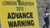 A road closure sign is seen placed along The Mall, the location for the London Marathon finish line, in central London, April 16, 2013.