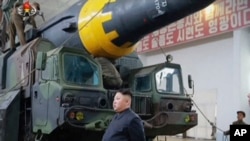 This image made from video of an undated still image broadcast in a news bulletin by North Korea's KRT on Monday, May 15, 2017, Kim Jong Un at what was said to be a missile test site at an undisclosed location in North Korea.