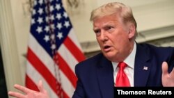 U.S. President Donald Trump participates in a Thanksgiving video teleconference with members of the military forces