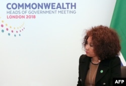FILE - South African Minister of International Relations and Co-operation, Lindiwe Sisulu, listens during bilateral talks with Britain's Foreign Secretary Boris Johnson in central London, April 17, 2018.