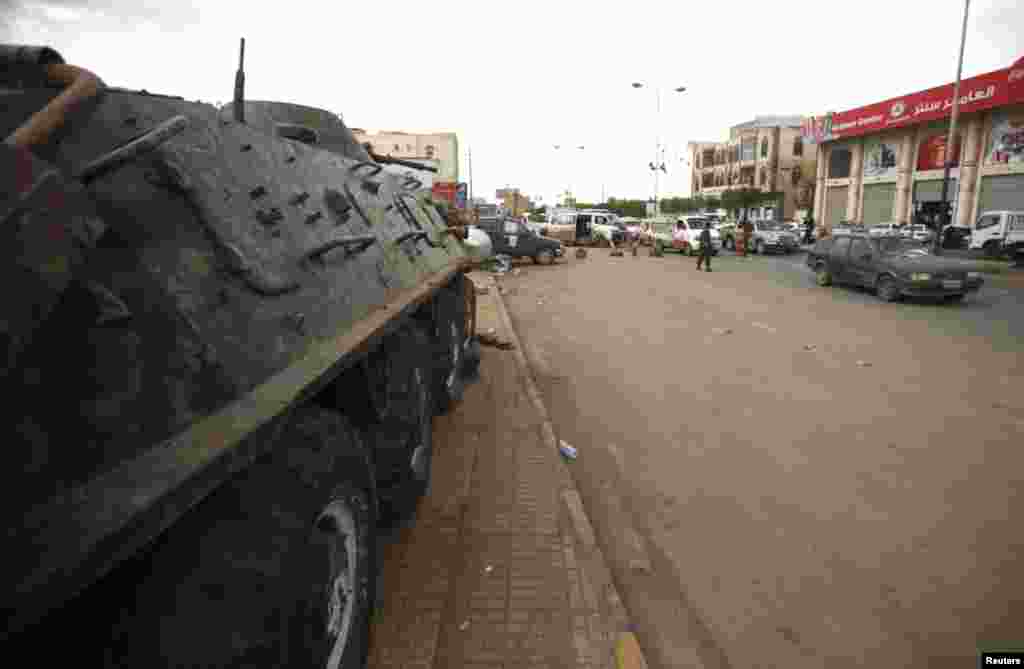A police armoured personnel carrier is stationed at a checkpoint on the road leading to the Sanaa International Airport August 6, 2013.