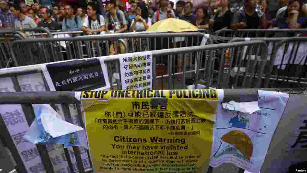 A message left by anti-Occupy protesters is displayed on Nathan Road recaptured by pro-democracy protesters at Mongkok shopping district in Hong Kong, Oct. 20, 2014.