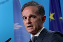FILE - German Foreign Minister Heiko Maas addresses the media in Berlin, Dec. 17, 2020.