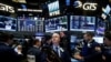 Traders work on the floor of the New York Stock Exchange (NYSE) in New York City, Nov. 7, 2016. 