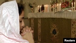 A Christian girl prays in Rawalpindi. Pakistan.