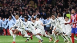 'Yan wasan Real Madrid na murnar kai wa zagayen Quater-final (Photo by Thomas COEX / AFP)