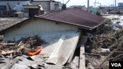 The quake and resulting tsunami waves killed an estimated 18,000 people and triggered the meltdowns of three nuclear reactors in Fukushima, Japan. (S. Herman/VOA)