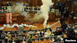 Kosovo opposition politicians release tear gas in parliament to obstruct a session in Pristina, Kosovo, March 21, 2018.