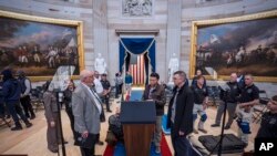 Organizers work to move the Inauguration Day swearing-in ceremony into the Capitol Rotunda due to expected frigid weather in Washington, Jan. 18, 2025. 