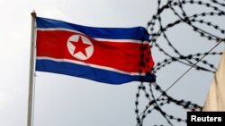 FILE - A North Korea flag flutters next to concertina wire at the North Korean embassy in Kuala Lumpur, Malaysia March 9, 2017.