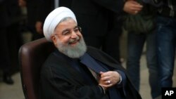 FILE - Iranian President Hassan Rouhani registers his candidacy for the May 19 presidential election at the Interior Ministry, in Tehran, Iran, April 14, 2017.
