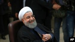 FILE - Iranian President Hassan Rouhani registers his candidacy for the May 19 presidential election at the Interior Ministry, in Tehran, Iran, April 14, 2017.