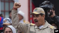 President Nicolas Maduro gestures to supporters during an event marking the 165th anniversary of the Battle of Santa Ines, in Caracas, Venezuela, Dec. 10, 2024.