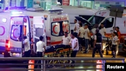 Ambulances arrive at Istanbul Ataturk Airport, Turkey, following explosions, June 28, 2016. 