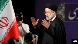 Ebrahim Raisi, head of Iran's judiciary, leaves a news conference after registering his candidacy for the June 18 presidential elections, at the elections headquarters at the Interior Ministry in Tehran, Iran, May 15, 2021.
