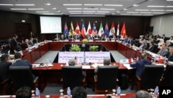 Trade ministers and delegates from the remaining members of the Trans-Pacific Partnership attend the TPP ministerial meeting on the sidelines of the Asia-Pacific Economic Cooperation summit, Nov. 9, 2017, in Danang, Vietnam.