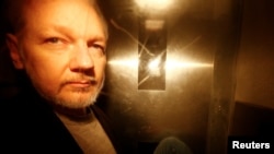 WikiLeaks founder Julian Assange leaves Southwark Crown Court after being sentenced in London, Britain, May 1, 2019. 