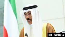 Kuwait's new Emir Nawaf al-Ahmad al-Sabah takes the oath of office at the parliament, in Kuwait City, Kuwait, Sept. 30, 2020. 