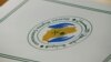 FILE - A folder with a logo of the Human Rights Commission of Saudi Arabia is pictured on a desk during the Universal Periodic Review of Saudi Arabia by the Human Rights Council at the United Nations Office in Geneva, Switzerland.