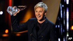 FILE - Ellen DeGeneres accepts the award for favorite daytime TV host at the 40th annual People's Choice Awards at the Nokia Theatre L.A. Live, Jan. 8, 2014. 