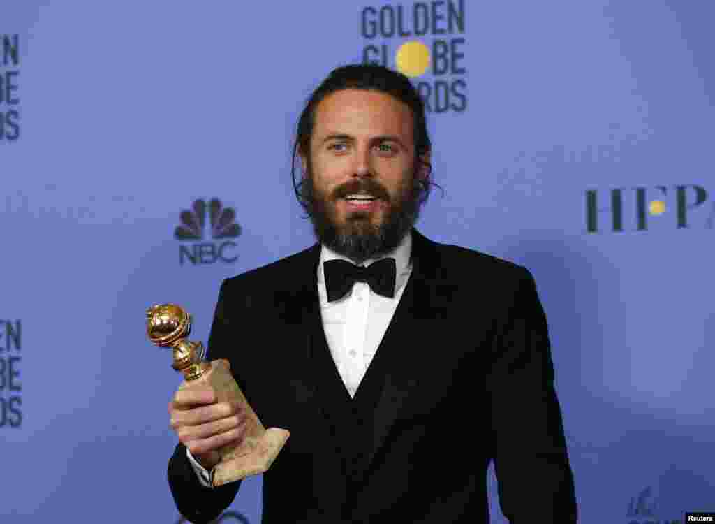 Casey Affleck holds the award for Best Performance by an Actor in a Motion Picture - Drama for his role in "Manchester By The Sea" during the 74th Annual Golden Globe Awards in Beverly Hills, CA, Jan. 8, 2017.