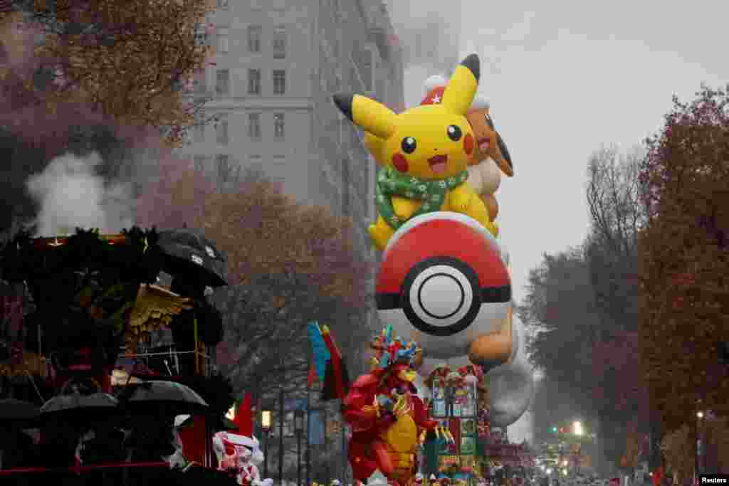Pikachu and Eevee balloon flies during the Macy's Thanksgiving Day Parade in New York City, Nov. 28, 2024.