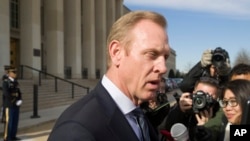 Acting Defense Secretary Patrick Shanahan speaks with the media as he waits for the arrival of NATO Secretary General Jens Stoltenberg at the Pentagon, Jan. 28, 2019, in Washington. 