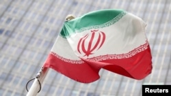 The Iranian flag flutters in front the International Atomic Energy Agency (IAEA) headquarters in Vienna, Austria, July 10, 2019.