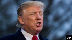 President Donald Trump speaks with the media after stepping off Marine One on the South Lawn of the White House, Sunday, March 24, 2019, in Washington. 