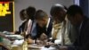 Traders work at the Zimbabwe Stock Exchange in Harare, Aug. 6, 2013. The country's stock exchange lost more than $650 million in value after plunging 11 percent on its first trade following the announcement of the country's election results.