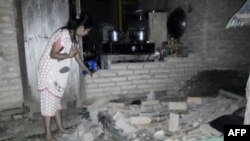 Une habitante du village de Tobadak, dans le centre de Mamuju, dans la province de Sulawesi, dans l’ouest de l'Indonésie, le 28 septembre 2018.