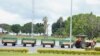 A tractor pulls special airport carts transporting the coffins of the victims of the March 10 Ethiopian Airlines Flight 302 crash from the terminal at the Jomo Kenyatta International Airport in Nairobi, Kenya, Oct. 14, 2019.