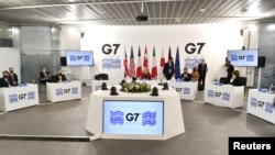 British Foreign Secretary Liz Truss speaks during a G-7 foreign and development ministers session with guest countries and ASEAN nations in Liverpool, Britain, Dec, 12, 2021. 