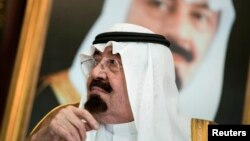 FILE - Saudi King Abdullah bin Abdul Aziz al-Saud sits before a meeting with U.S. Secretary of State John Kerry at the Royal Palace, Jeddah.