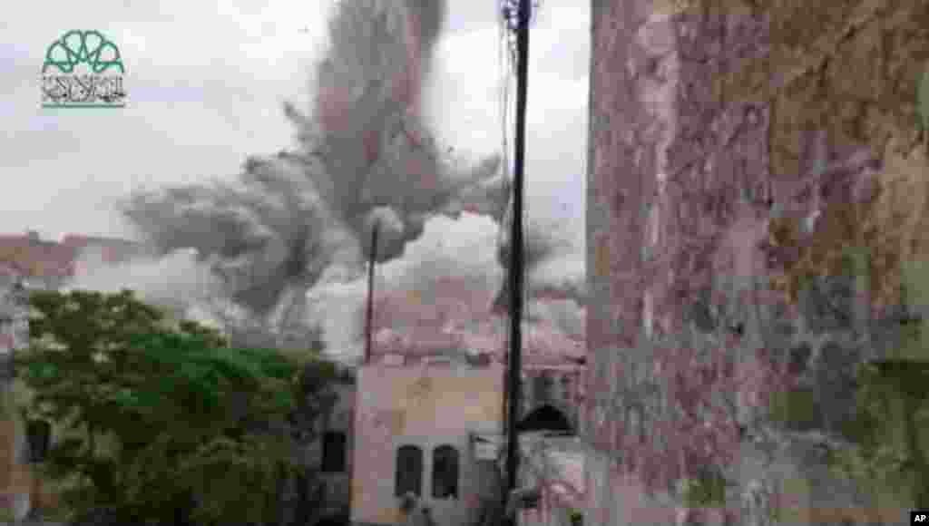 This scene taken from amateur video shows an explosion that destroyed the Carlton Hotel in Aleppo, May 8, 2014.