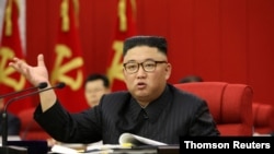 FILE - In this image distributed by the North Korean government, North Korean leader Kim Jong Un speaks during the 3rd Plenary Meeting of the 8th Central Committee of the Workers' Party of Korea in Pyongyang, North Korea, June 17, 2021.
