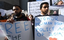 FILE - Uighur activists and their supporters rally in defense of Uighur rights in China, in front of the U.S. Mission to the United Nations, in New York City, Feb. 5, 2019.