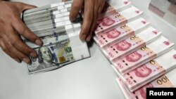 China tidak dapat membuat perubahan besar pada komposisi cadangan devisanya, karena diperlukan untuk pengelolaan nilai tukar renminbi (foto: ilustrasi). 