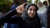 A young voter shows with pride proof she took part in Egypt's first widely contested presidential election, May 23, 2012. (Yuli Weeks/VOA)