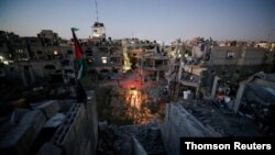 A general view of damaged houses which were destroyed by Israeli air strikes during the Israel-Hamas fighting in Gaza, May 23, 2021.
