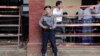 FILE - A police officer stands guard at Insein court in Yangon, Myanmar, Feb. 15, 2019.