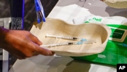 Two doses of the Covid vaccine at Heaven club in London, Aug. 8, 2021. London's Heaven club has become the UK's first nightclub to be turned into a pop-up Covid vaccination center.