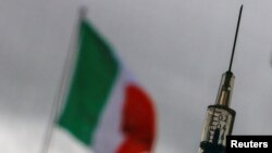 FILE - A syringe with a dose of the AstraZeneca vaccine against the coronavirus disease is seen in a vaccination center at the Cecchignola military compound, in Rome, Italy, March 9, 2021. 