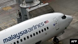 Pesawat Malaysia Airlines di Bandar Udara Internasional Kuala Lumpur di Sepang (14/5). (AFP/Manan Vatsyayana)