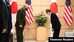 Commandant of the Marine Corps of the U.S. General David H. Berger meets with Japan's Prime Minister Yoshihide Suga in Tokyo