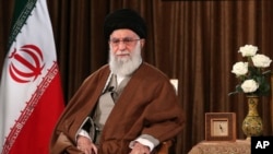 FILE - In this picture released by his office's website, Supreme Leader Ayatollah Ali Khamenei sits prior to an address to the nation on state television, in Tehran, Iran, March 22, 2020.