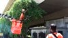 Virus Surge Among Migrants Highlights Singapore’s Two-track Economy 