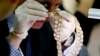 Christie&#39;s auction house appraiser David Warren examines a set of jewelry from Roumeliotes Collection, one of three sets of the Marcos Jewelry Collection, during appraisal at the Central Bank of the Philippines in Manila. The Philippine government is having millions of dollars&rsquo; worth of jewelry seized from former First Lady Imelda Marcos appraised ahead of a possible auctioning of the collection. The jewelry was seized when Marcos&rsquo; family fled to Hawaii in 1986 following a revolt that ended her husband&rsquo;s two decades in power.