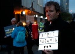 FILE -- Richard Ratcliffe husband of imprisoned charity worker Nazanin Zaghari-Ratcliffe, poses for the media during an Amnesty International led vigil outside the Iranian Embassy in London, Jan. 16, 2017.