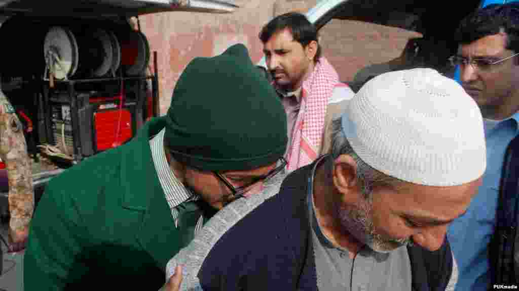 A student cries on a man's shoulder, after he was rescued from the school that was attacked by Taliban gunmen in Peshawar, Pakistan, Dec. 16, 2014.